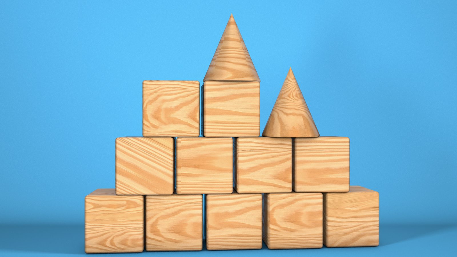 Wooden blocks stacked into a small structure against a blue background.