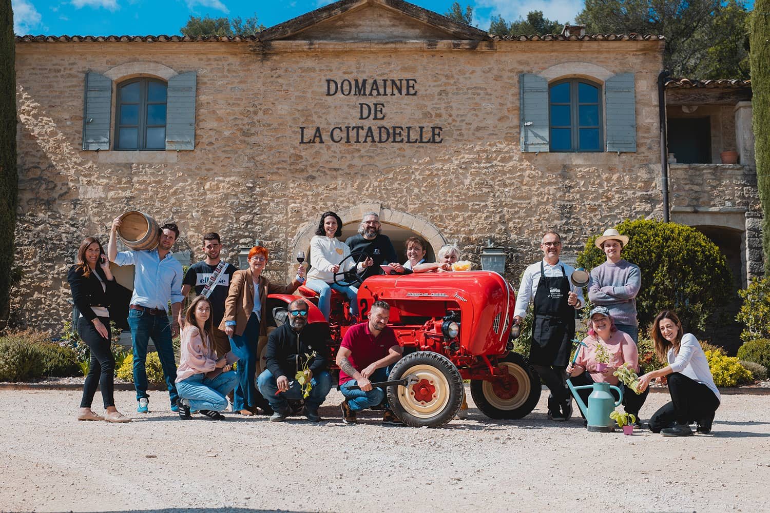 The Domaine de la Citadelle team outside the stone wine estate in Ménerbes.