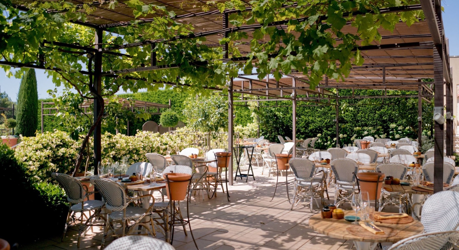 Cipressa’s leafy shaded terrace at Coquillade Provence.