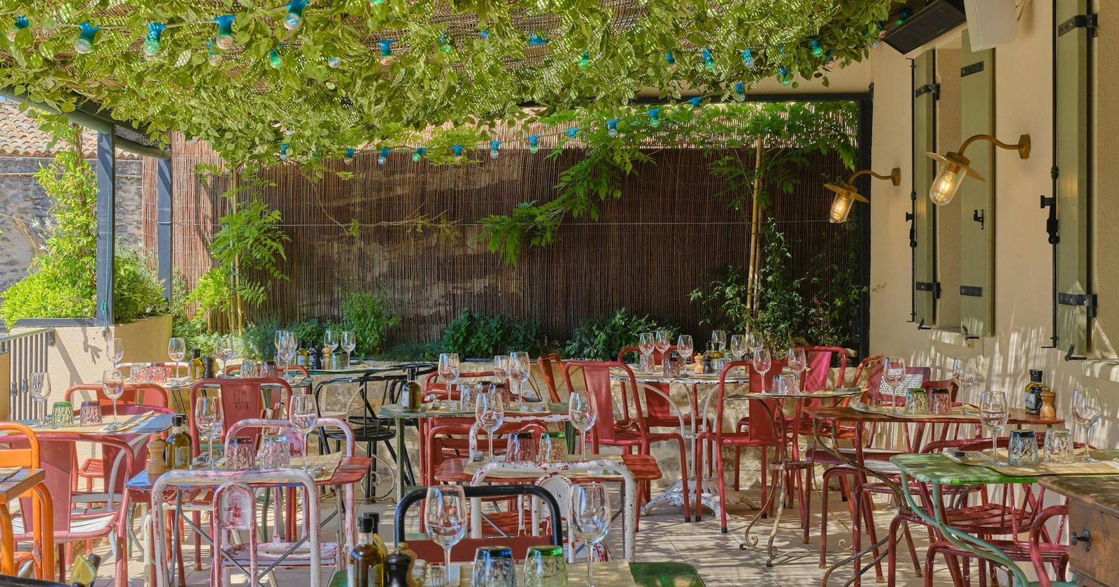 The colourful shaded terrace at La Bastide de Pierres in Gordes.