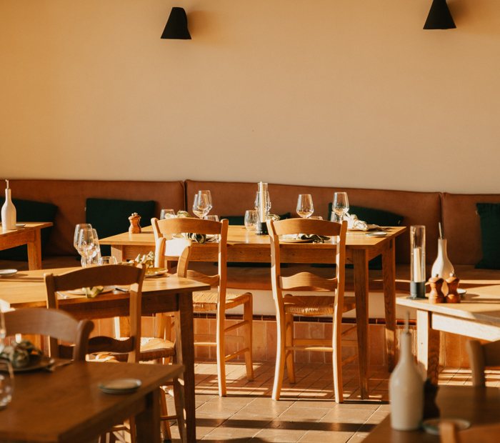 The warm, wood-lined dining room at La Bergerie, Capelongue.