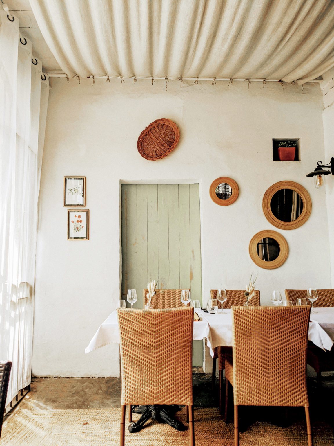 The calm, pale dining room at La Terrasse in Goult.