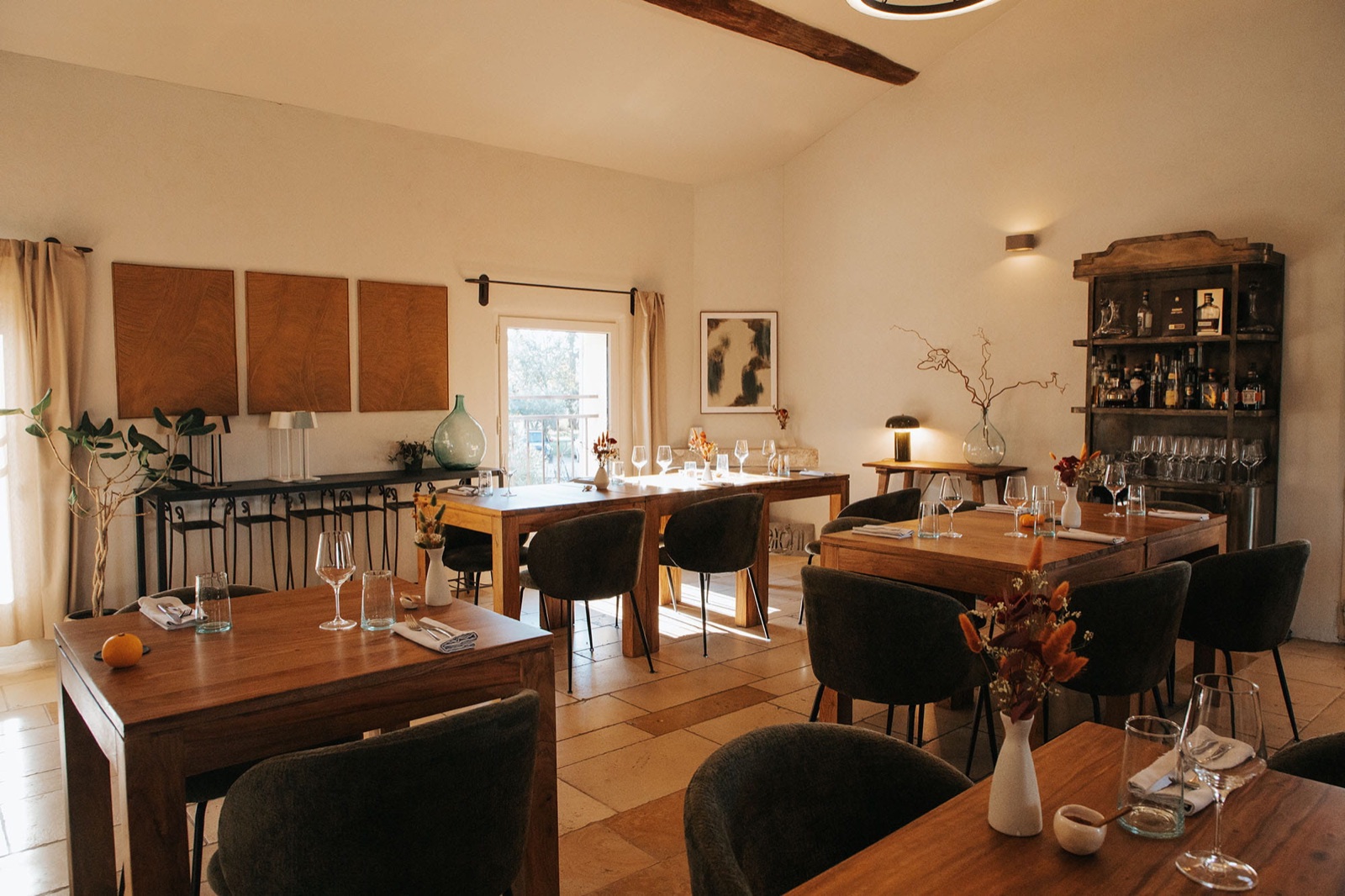 The warm dining room at Maison Aréni on the Château La Croix des Pins wine estate.